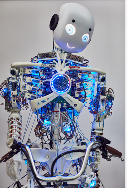 Roboy 2.0 Full size humaoid robot smiling, off white, showing robotic tendons and muscles