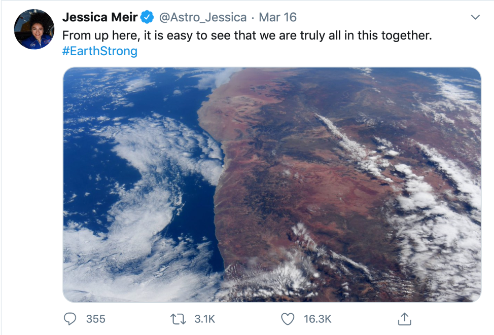 Tweet from Jessica Meir. “From up here, it is easy to see that we are truly all in this together. #EarthStrong” Image of part of Earth from far above.