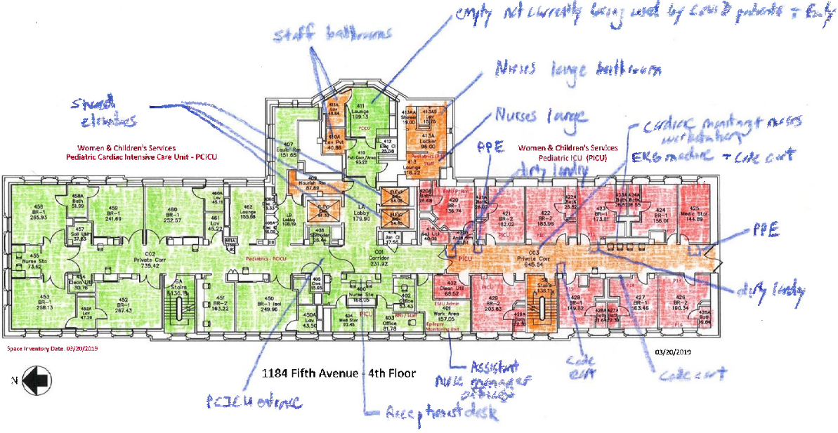 A floorplan colored in green and red with handwritten notes.