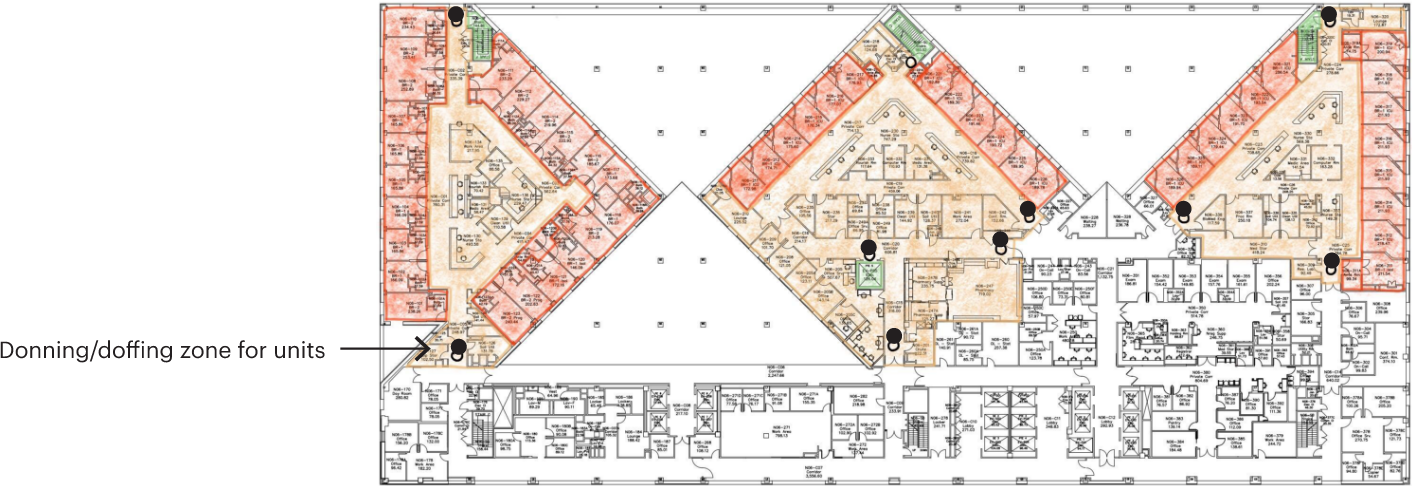 A floorplan colored in tan, red, and green sections.