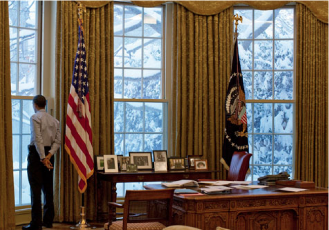 Barak Obama alone in the Oval Office