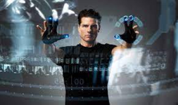 Tom Cruise in Minority Report gesture controlling a large screen-like window, before gesture control existed.