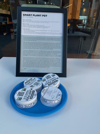 Round discs covered in paper labels that say “Plant Puck” on them with QR codes and directions on use.